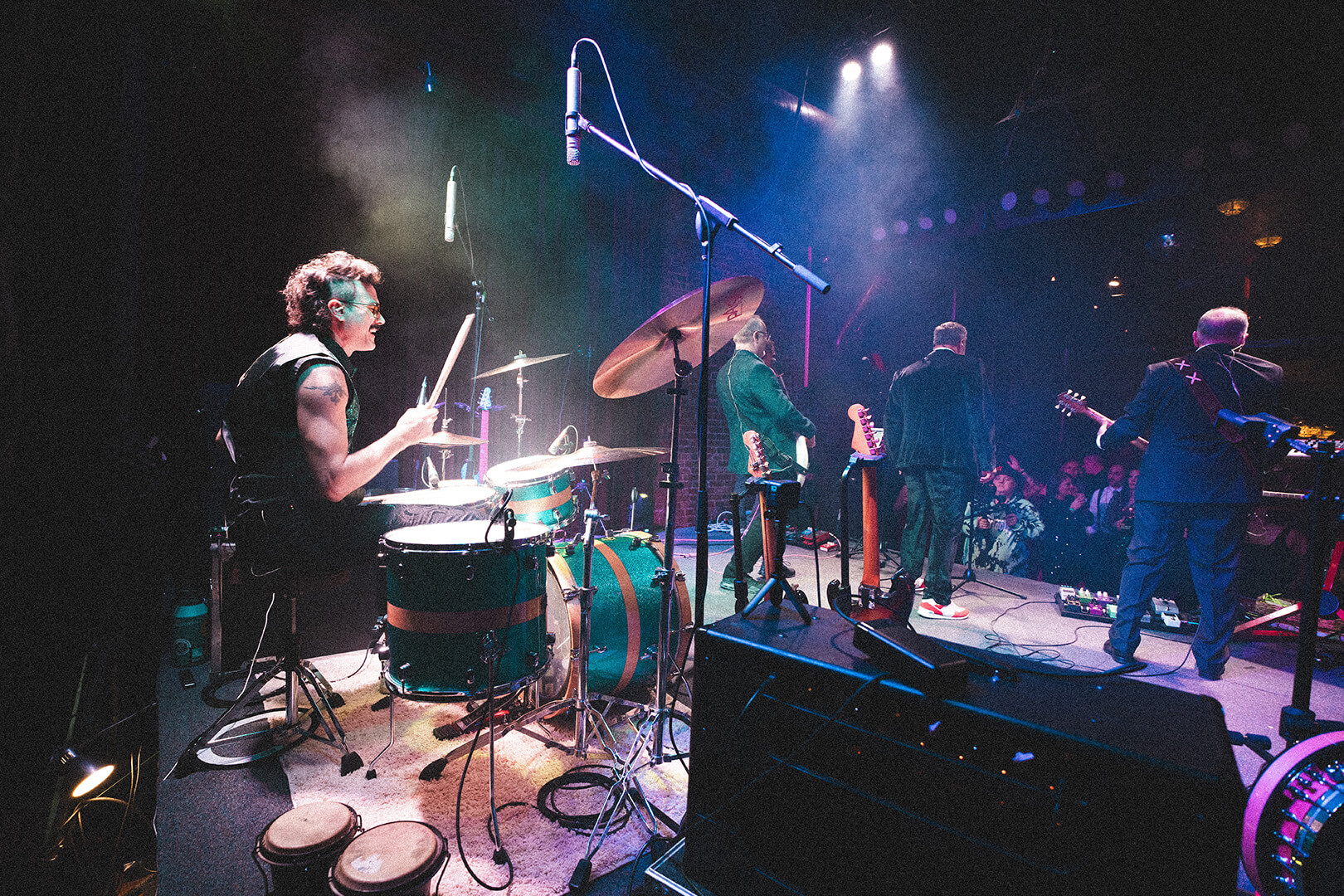 Drummer and band performing live
