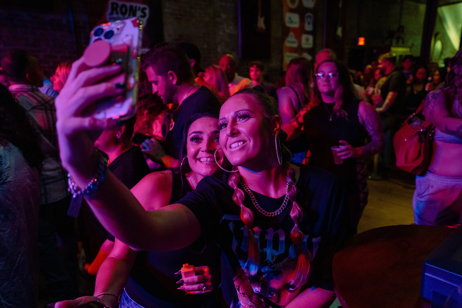 Fans taking a selfie at a show